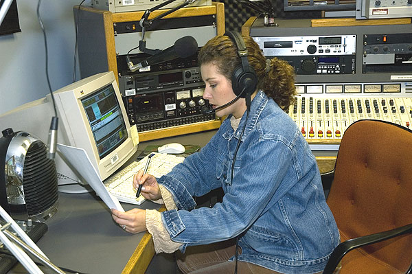 Reading the news at the radio station