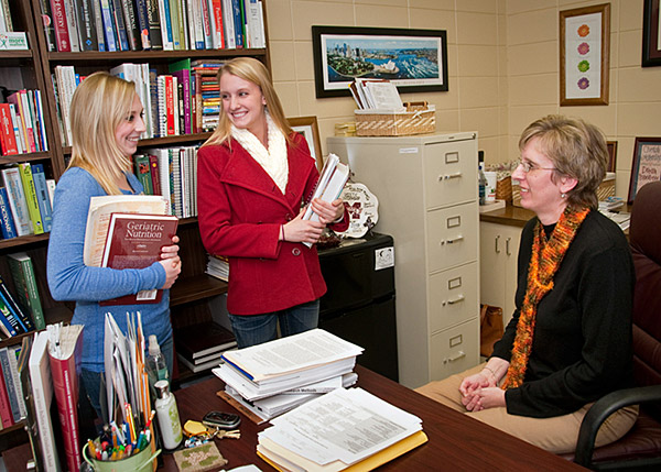 Food Science students talk with professor