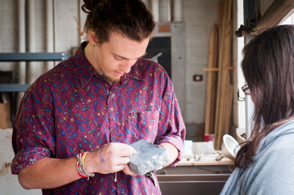 Sculpture students work with soapstone