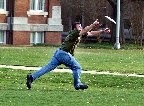 Throwing frisbee on the Drill Field