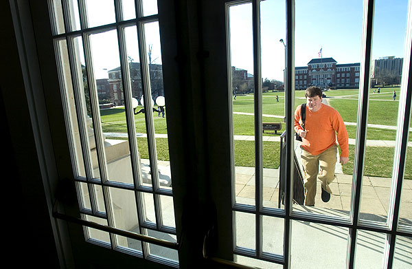 Student entering Lee Hall