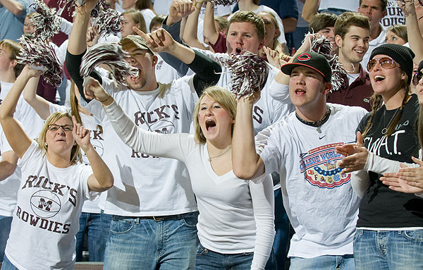 Fans cheering at basketball game against Ole Miss