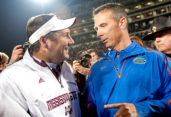 Dan Mullen and Urban Meyer greet each other after the game