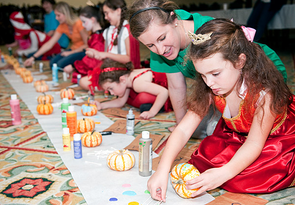 Girl Scouts paint pumpkins at the Kappa Delta house