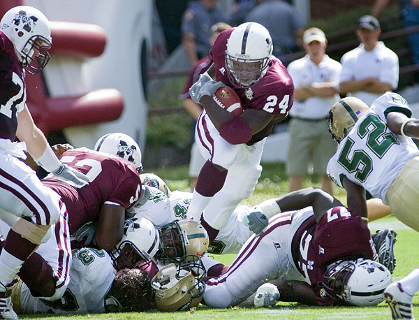 Anthony Dixon runs the ball against Tulane