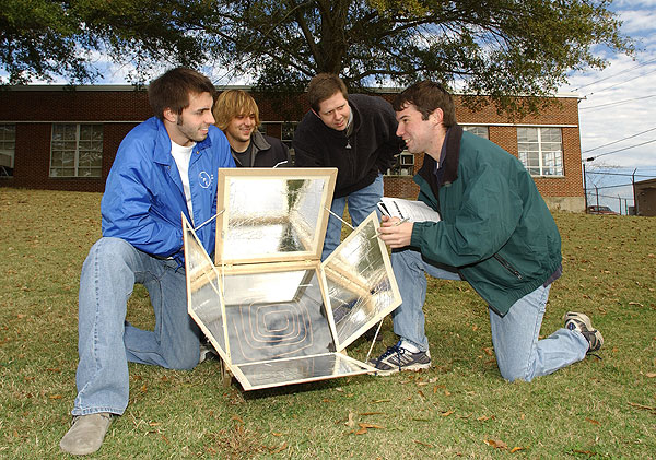 Architecture students testing solar heaters