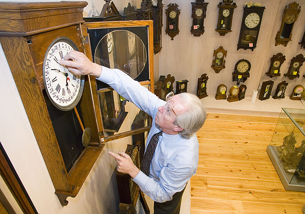 Skip Wyatt winds up a clock at the Cullis Wade Depot