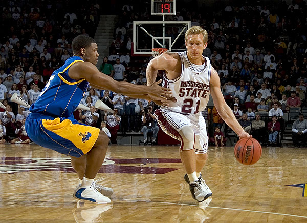 Shane Powers drives to the basketball vs Missouri Kansas Cit