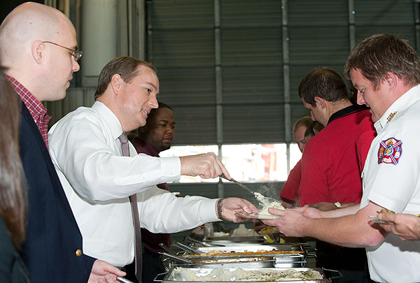 President Keenum serving food to firefighters