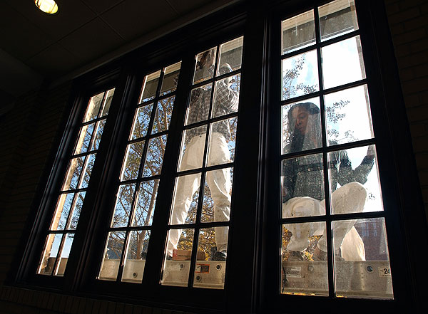 Preparing to paint cafeteria windows