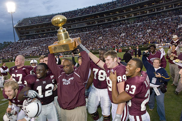 Coach Croom hoist Egg Bowl trophy