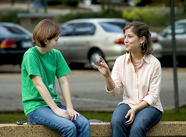 Students talking near bakery