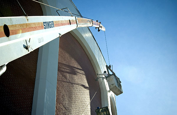 Painting exterior of Coliseum