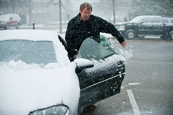 Clearing snow from vehicle