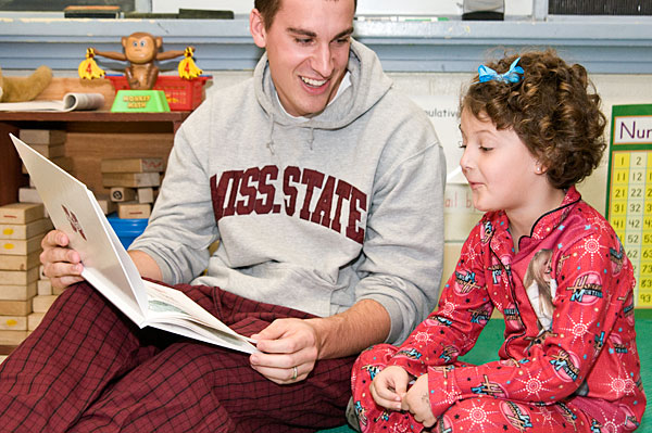 Students read to Sudduth Elementary kindergarten class