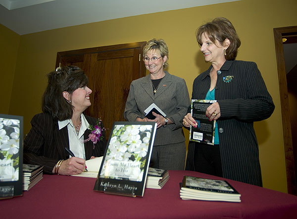 Kathy Hayes signing books