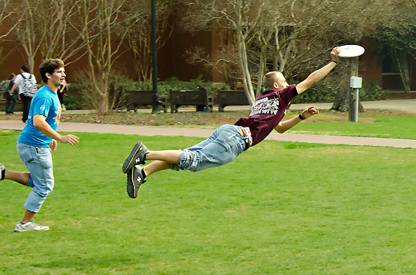 Catching frisbee on the Drill Field