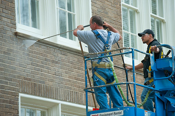 Spraywashing bricks at Harned Hall