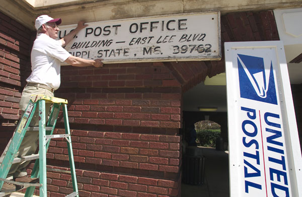 Out with the old hand-printed Post Office sign