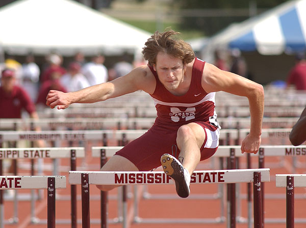 Jumpng hurdles at track meet