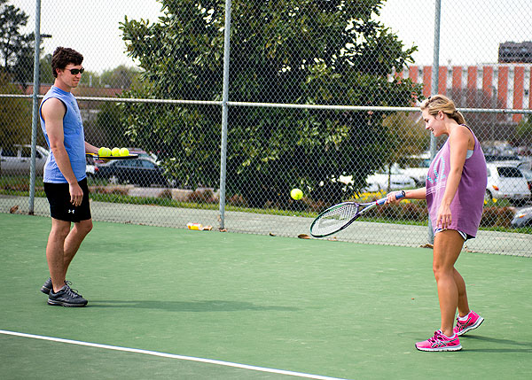 Students Kaleigh Davis and Weston Swims Playing Tennis