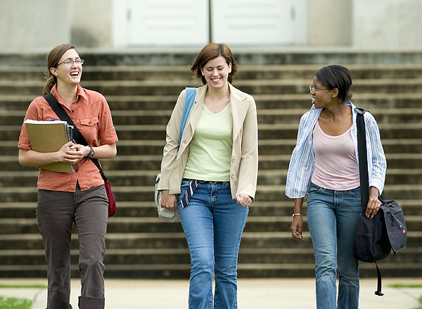 Students enjoy a laugh while walking to class