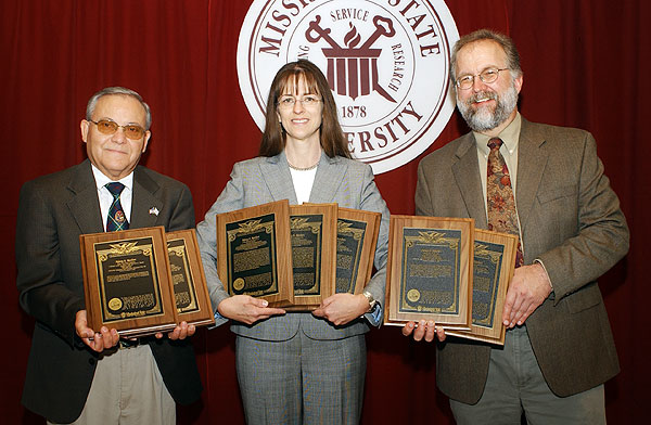 Nancy Reichert with patent plaques