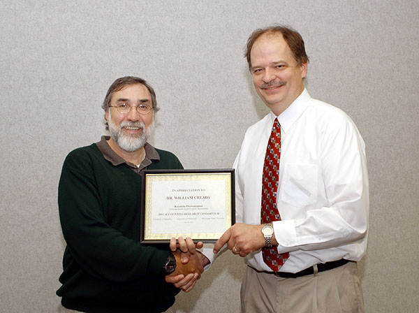 Noel Addy giving award to Bill Cready