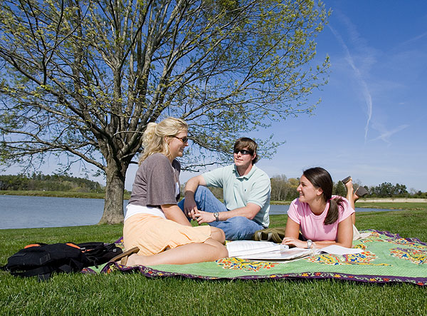 Students relaxing by Chadwick Lake