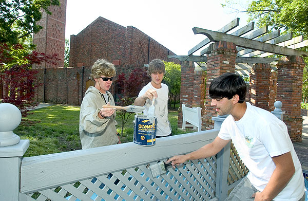 Painting fence near Chapel