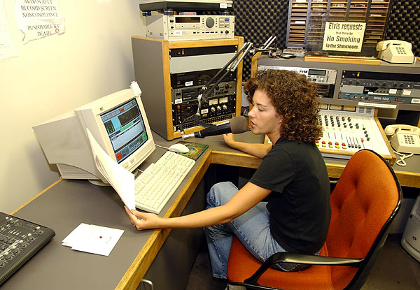 Krista Wolf recording news at radio station