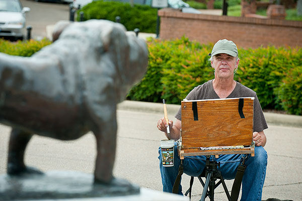 Wyatt Waters paints the bully statue at Union