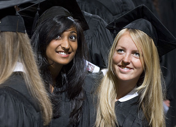 Happy MSU grads smile for some friends