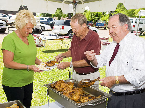 Dr. Watson and Ed Blakesly serving chicken