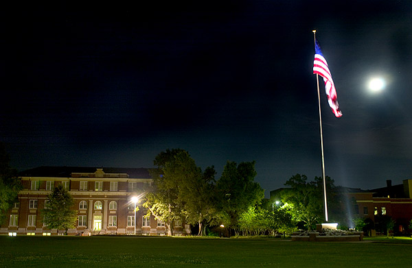 Drill Field flag at night