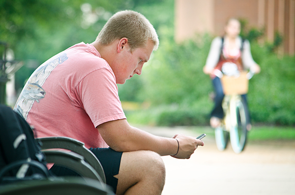 Student enjoys morning breeze before summer classes.