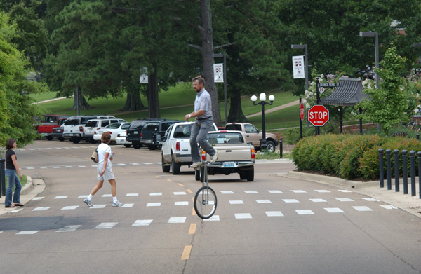 High Riding Jim Schrock riding his unicycle