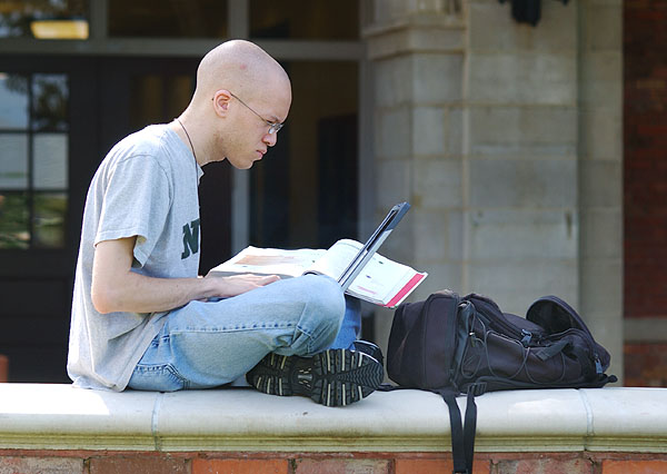 Studying with laptop outside McCain Engineering