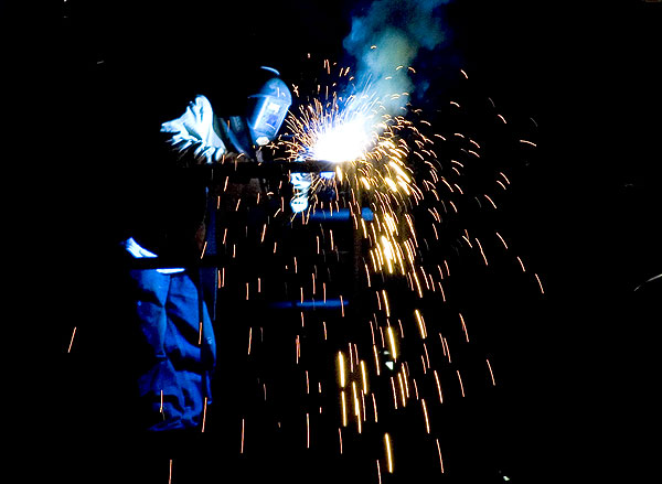 Welding on new jumbotron in Humphrey Coliseum