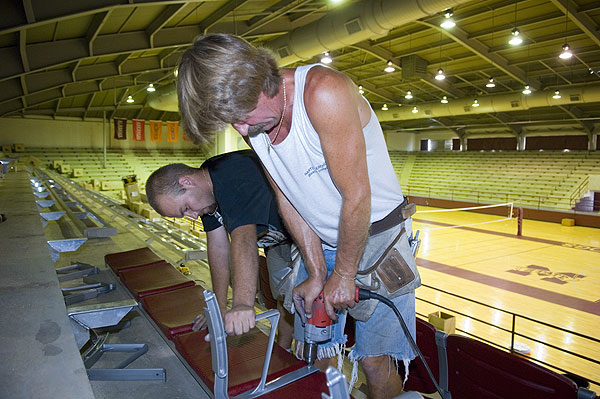 Installing new seats at Newell Grissom for volleyball season