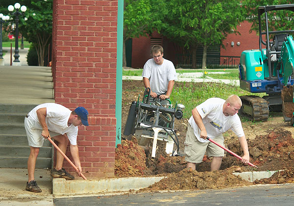 Installing irrigation at Health Center