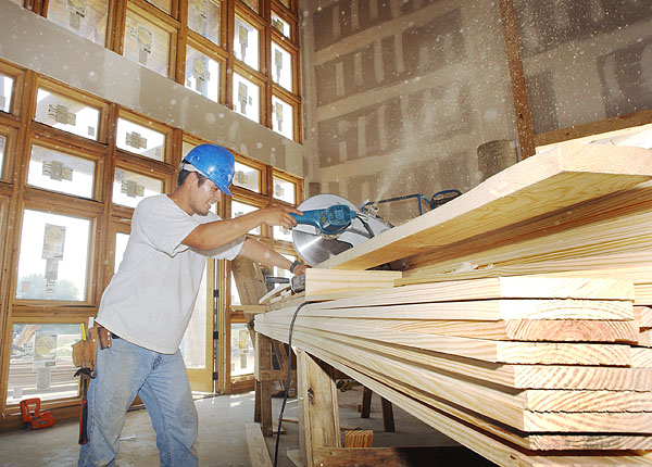 Sawing wood for the Furniture Research Center