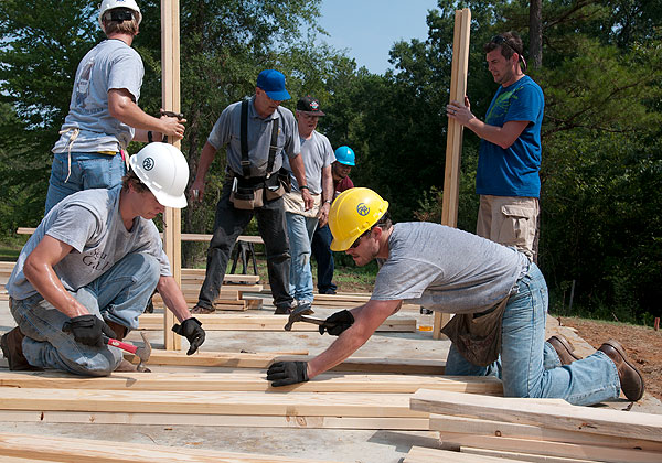 Students help build habitat house.