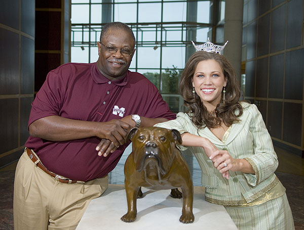 Coach Croom poses with Miss Mississippi, Taryn Foshee