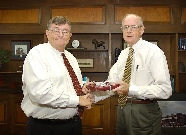 Dr. Lee gives gift to Bob Williams