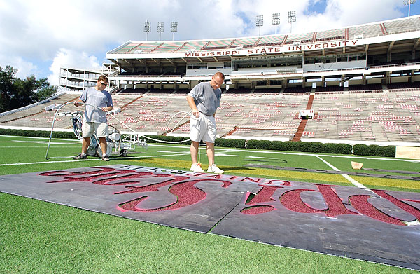 Painting football field in preparation for football opener