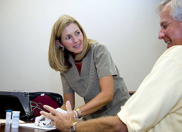 Janice Moore runs tests on Luther Epting