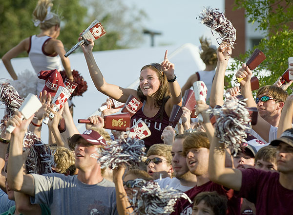 Students ring their cowbells at pep rally