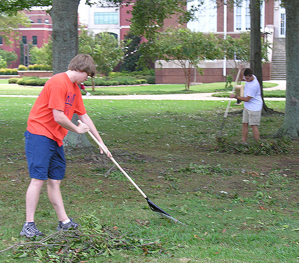 Student volunteers clean up after hurricane