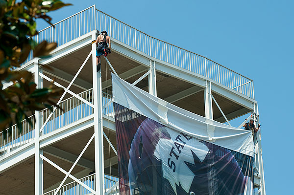 Installing banners at Davis Wade Stadium